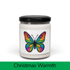 Front view: Juliet’s Butterfly soy candle — 9oz glass jar with butterfly label, Christmas Warmth scent.