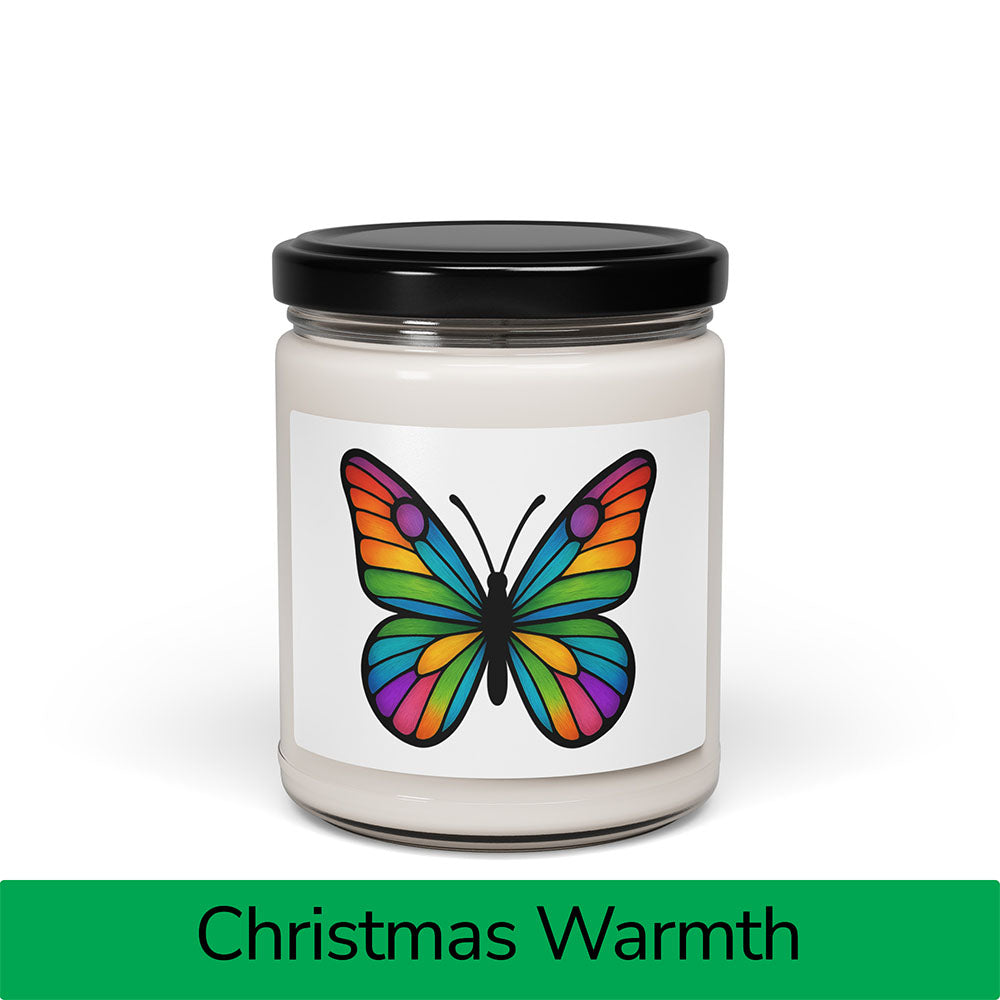Front view: Juliet’s Butterfly soy candle — 9oz glass jar with butterfly label, Christmas Warmth scent.
