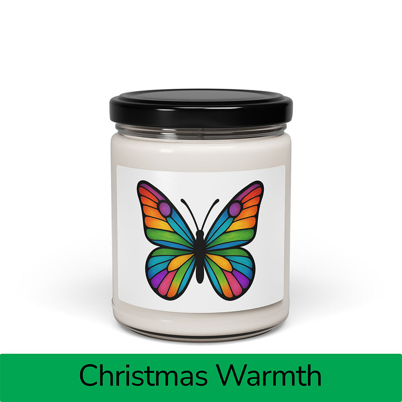 Front view: Juliet’s Butterfly soy candle — 9oz glass jar with butterfly label, Christmas Warmth scent.