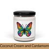 Front view: Juliet’s Butterfly soy candle — 9oz glass jar with butterfly label, Coconut Cream and Cardamom scent.