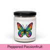 Front view: Juliet’s Butterfly soy candle — 9oz glass jar with butterfly label, Peppered Passionfruit scent.