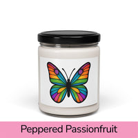 Front view: Juliet’s Butterfly soy candle — 9oz glass jar with butterfly label, Peppered Passionfruit scent.