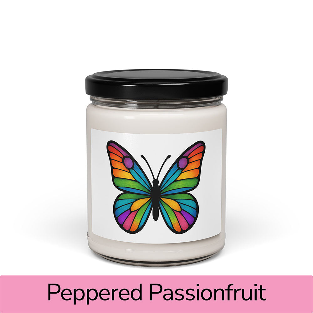 Front view: Juliet’s Butterfly soy candle — 9oz glass jar with butterfly label, Peppered Passionfruit scent.